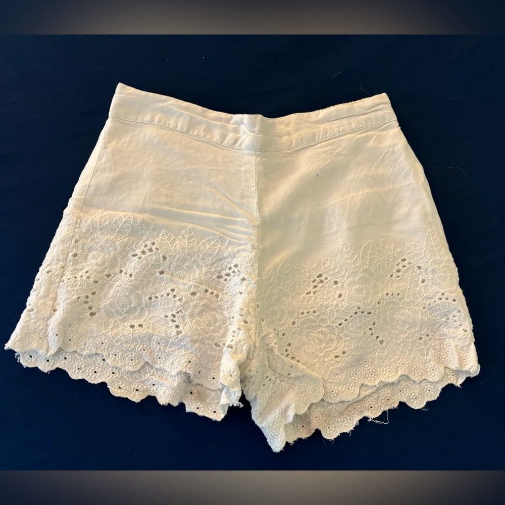 White eyelet edge lined shorts, size small.